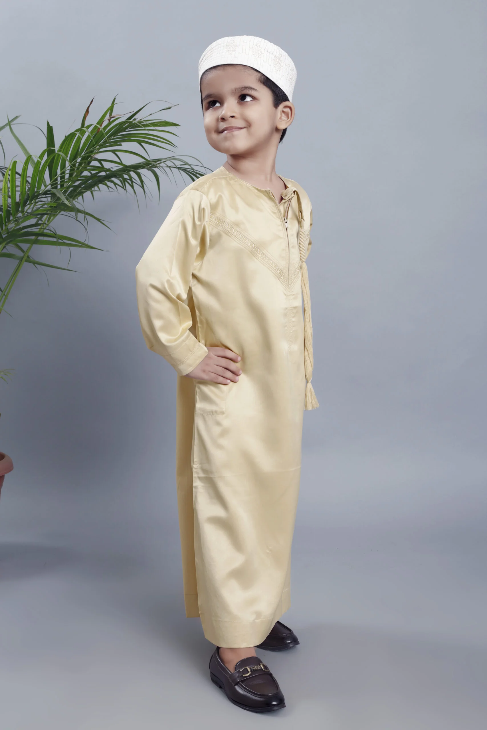 Threads of Radiance: Golden Emarati Kids Thobe - A Golden Journey in Heritage